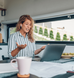 A woman is explaining via video call